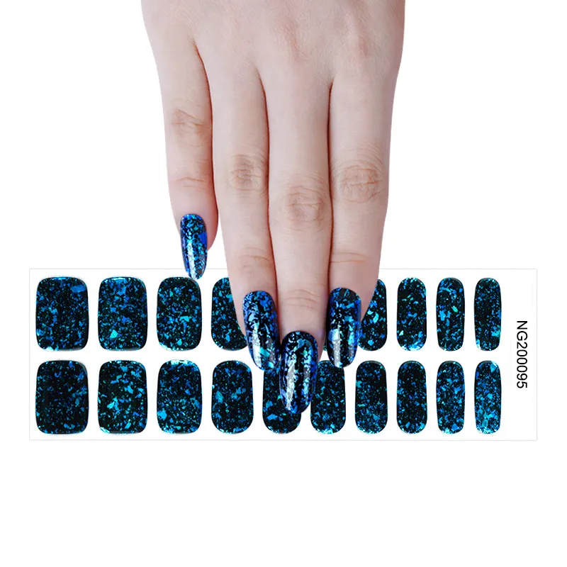 Hand with blue glitter nails above matching NG200095 stickers