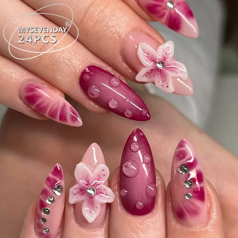 Pink maroon almond nails with floral and waterdrop designs